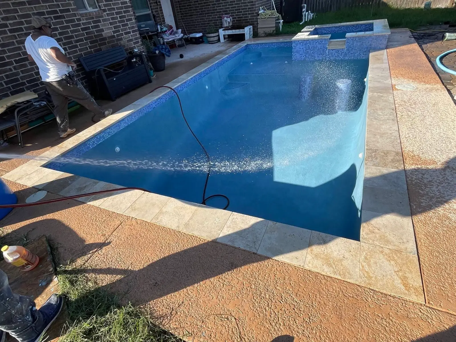 Same pool filling with water over the new plaster